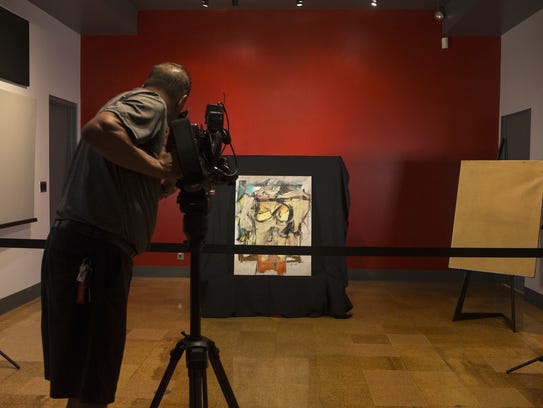 Willem de Kooning's "Woman-Ochre" painting on display,