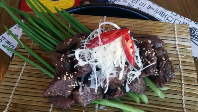 Korean bulgogi combines soy sauce, rice wine and garlic with thin sliced chuck beef.