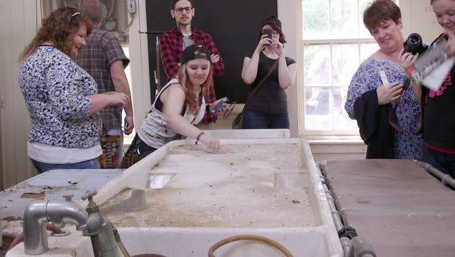 Tour attendees at the Willard morgue on May 16, 2015.