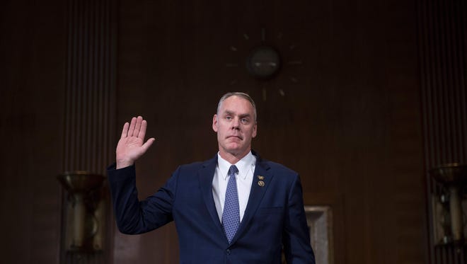 US Congressman Ryan Zinke, R-Montana, is sworn in before testifying before Senate Committee on Energy and Natural Resources on Capitol Hill in Washington, DC, January 17, 2017, on his nomination to be Secretary of the Interior in the Trump administration.