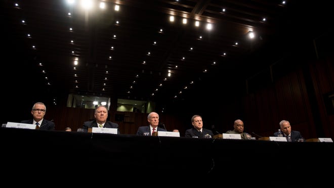 Adm. Mike Rogers, then-director the National Security Agency, fourth from left, testifies May 11, 2017, with other intelligence officials at the Senate Intelligence Committee on Capitol Hill in Washington, D.C. In the case of an NSA worker bringing classified documents home, Rogers warned a federal judge of great economic and operational harm from possible revelations about the nation's most closely guarded secrets.