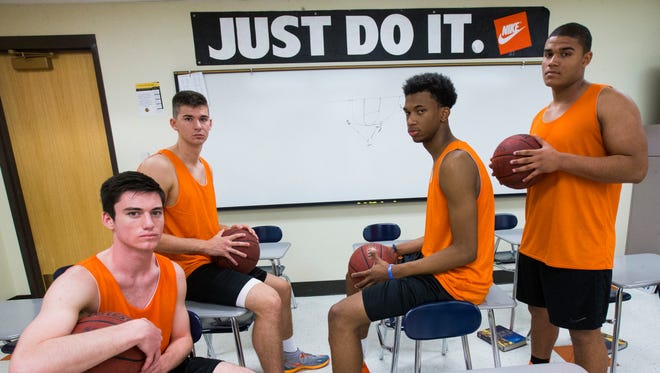 Top Corona del Sol basketball players (from left) guard Alex Barcello, forward Dane Kuiper, center Marvin Bagley III and forward Cassius Peat in a classroom in Tempe November 17, 2014.