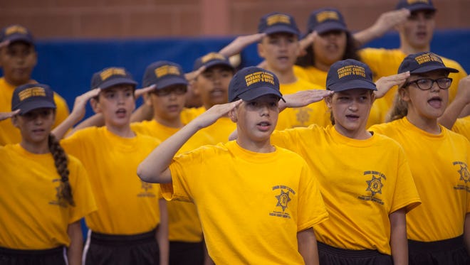 Recruits stand at attention during the Passaic County Sheriff's Junior Police Academy graduation ceremony in Wayne last August. The Clifton Police Department will launch its first academy program this July.