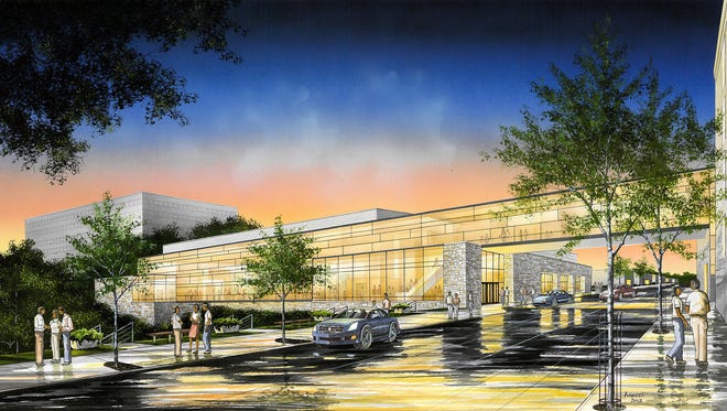 A drawing depicts the proposed Fox Cities Exhibition Center across Lawrence Street from the rear of the Radisson Paper Valley Hotel in Appleton.