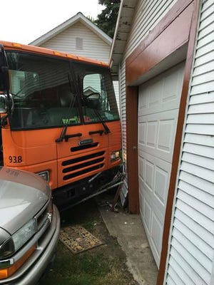 A Lansing recycling truck crashed into this garage June 16, 2016. The garage was torn down that  day as a precaution but the owner is still waiting for a replacement.