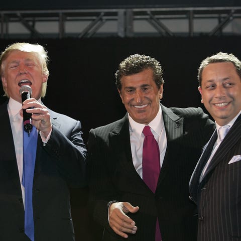 Donald Trump, Tevfik Arif and Felix Sater attend...