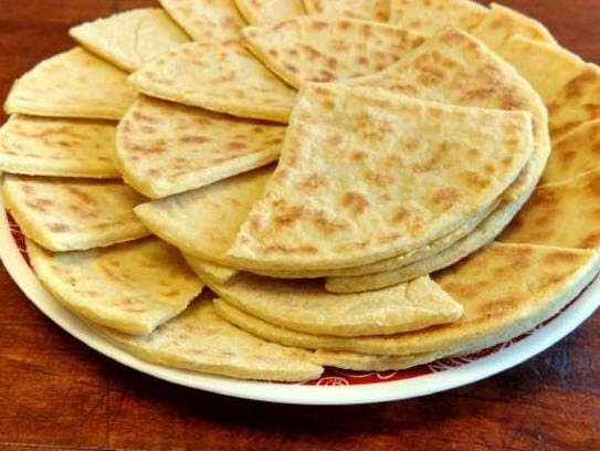 Potato scones, an Irish breakfast item prepared on