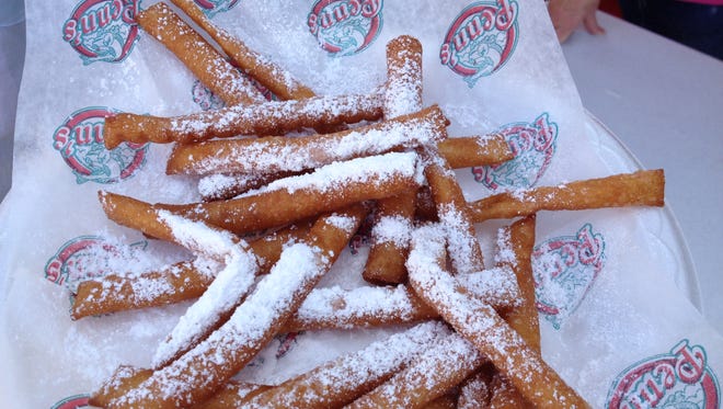 Funnel Cake Fries are fairly new at The Mississippi State Fair. They're funnel cakes, cut into strips - for sharing!