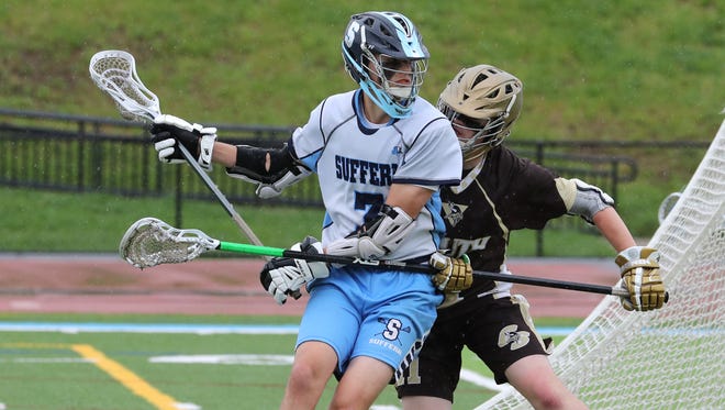 Suffern's Billy Mahecha is pressured by Clarkstown South's James Distefano during their Class A first round game at Suffern May 19, 2018. Suffern won 16-3.