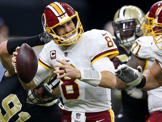 Washington Redskins quarterback Kirk Cousins is pressured
