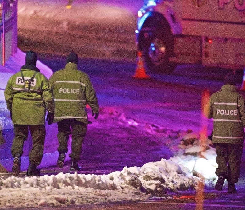 Quebec provincial police officers at the scene where two gunmen opened fire at the Quebec Islamic Cultural Centre in Quebec City, Canada, on Jan. 30.