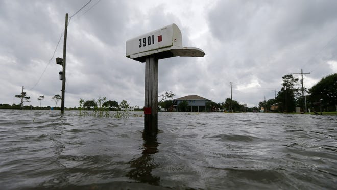 A mailbox sticks out of water during neighborhood flooding after Tropical Storm Cindy, now downgraded to Tropical Depression Cindy, in Big Lake, La., Thursday, June 22, 2017.