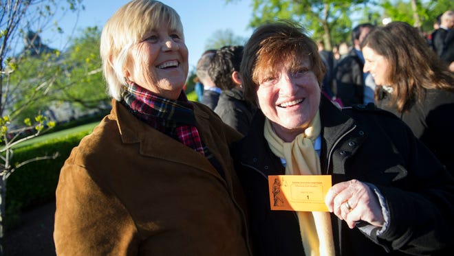 Diane Olson, left, and her wife Robin Tyler, of Los Angeles, show off their number 1 ticket for the first in-line for a seat in the Supreme Court while waiting to enter the court in Washington, Tuesday, April 28, 2015. The Supreme Court is set to hear historic arguments in cases that could make same-sex marriage the law of the land. The justices are meeting Tuesday to offer the first public indication of where they stand in the dispute over whether states can continue defining marriage as the union of a man and a woman, or whether the Constitution gives gay and lesbian couples the right to marry. (AP Photo/Cliff Owen)