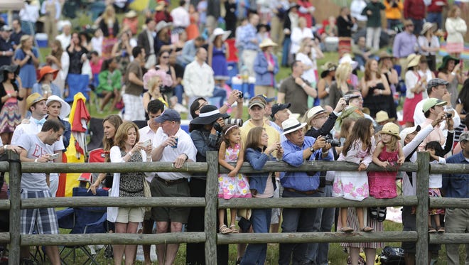 Fans watch for their favorite horse during the Iroquois Steeplechase at Percy Warner Park in 2012.