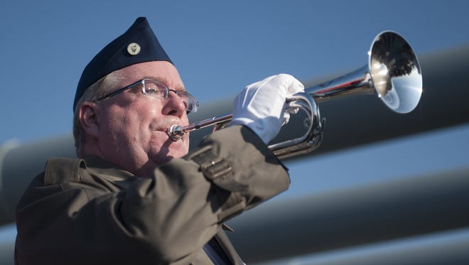 Bugler Greg Murphy plays Taps during the Pearl Harbor Day Commemoration aboard the Battleship New Jersey in 2015. He appears tonight on the TV show 'Shades of Blue.'