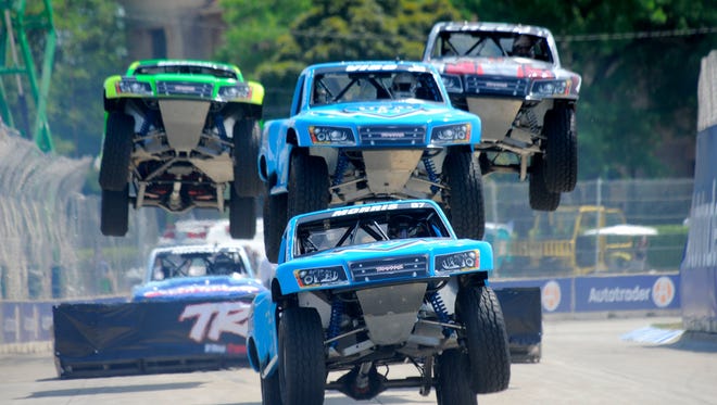 Paul Morris leads a group of trucks off the ramp between turns eight and nine on Friday during the first race of the SPEED Energy Stadium SUPER Truck Series on Belle Isle in Detroit.