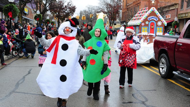 Representatives of Wiggles & Giggles Pre-School & Childcare show their holiday spirit at the Milford Christmas Parade.