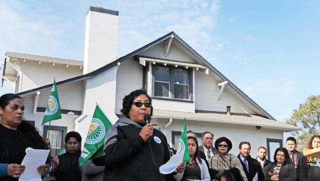 Acosta Plaza resident Daria Espinoza speaks at Thursday's announcement celebrating the purchase of the one acre-Sanborn Ranch House, which is in the center of the Acosta Plaza complex.  