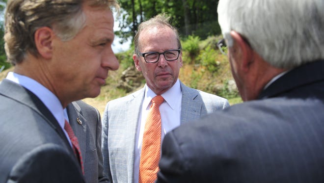 Gov. Bill Haslam and TDOT Commissioner John Schroer speak during a ribbon-cutting ceremony of the $23.4 million widening project of Mack Hatcher Parkway in Franklin on July 16, 2014. Schroer will retire in 2019 after eight years leading TDOT.