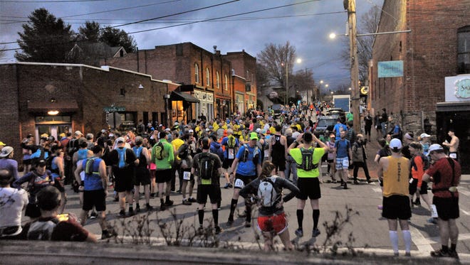 Around 500 runners gather downtown in the pre-dawn hours for the 2018 Mount Mitchell Challenge and Black Mountain Marathon on Feb. 24.