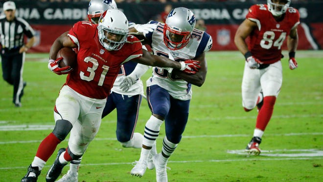 Arizona Cardinals running back David Johnson (31) runs the ball in the fourth quarter against the New England Patriots in Glendale on Sunday, Sept. 11, 2016.