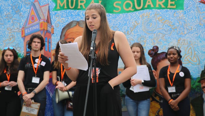 Arlington student Angela McDevitt, 17, delivers a speech on Sunday. She discussed the need for stricter gun laws as well as increased mental health help in the wake of school shootings.