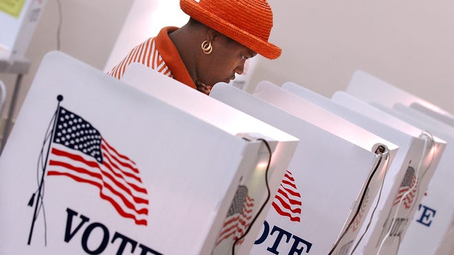 Shinequa Reddick, 26, fills out her ballot at Precinct 7 inside the St. Lucie County Civic Center.