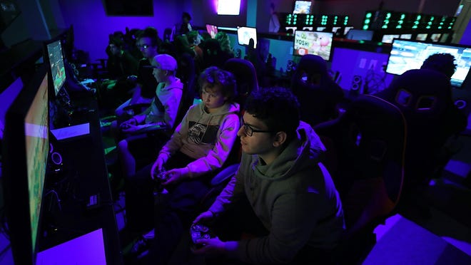 Dylan Rowe, 13, of Duxbury, aka Supremelol, takes on Alexander Martins, aka pugwest, in a game of Super Smash Brothers in the pit during their weekly tournament at Uptime Esports in Hanover.