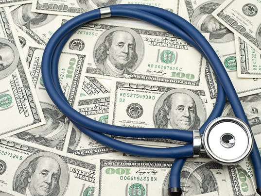 heap of dollars with stethoscope