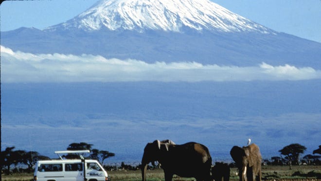 A view of Mt. Kilimanjaro and elephants viewed by safari participants on a Micato Safari in Kenya.