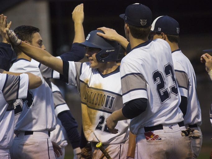 Dallastown's Pete Capobianco, center-left, is congratulated