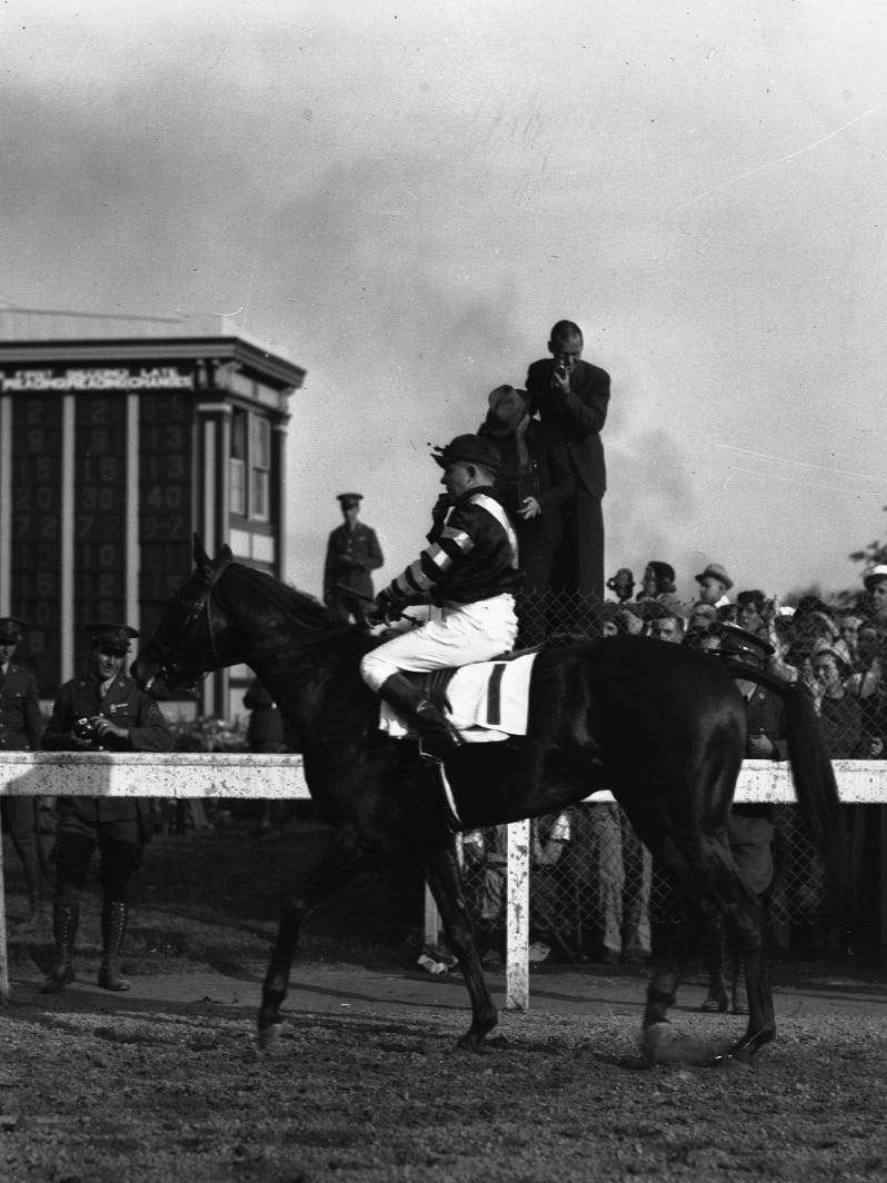 Winner of the 1937 Kentucky Derby, War Admiral and jockey Charley Kurtsinger. May 8, 1937