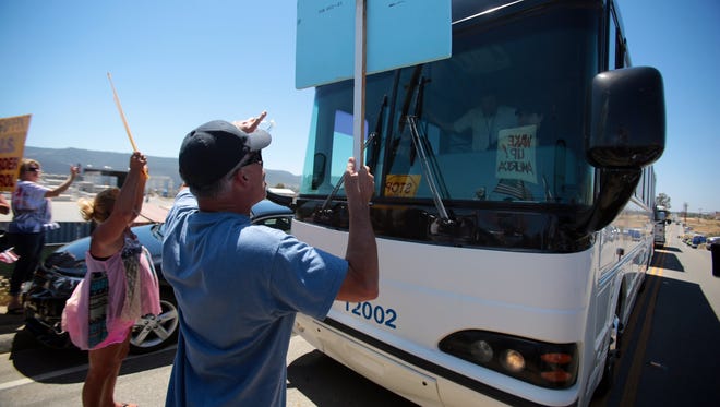 Protesters try to stop buses from arriving at the Murrieta Border Patrol station.
