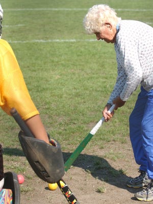 -

--

Bea Thomas, then 92, coaches field hockey players at Moorestown High School in 2004.