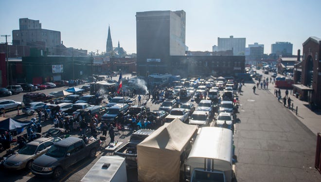 Parking lots at Eastern Market fill up with people tailgating before the Lions' game against the Washington Redskins on Sunday, Oct. 23, 2016.