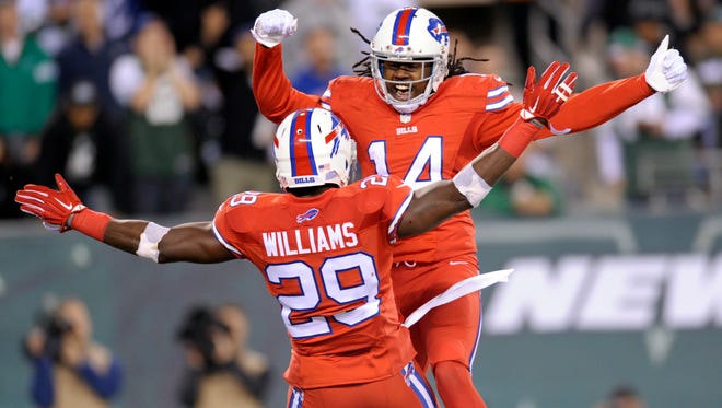 Buffalo Bills running back Karlos Williams, front, and wide receiver Sammy Watkins celebrate Williams' touchdown catch against the New York Jets during the second half of an NFL football game, Thursday, Nov. 12, 2015, in East Rutherford, N.J. (AP Photo/Bill Kostroun)