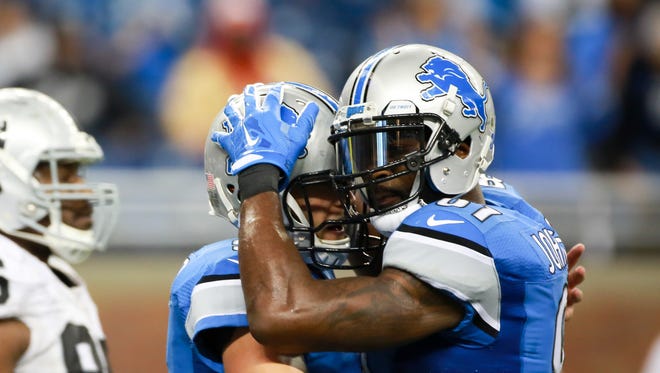 Detroit Lions QB Matthew Stafford and WR Calvin Johnson during the win against Oakland.