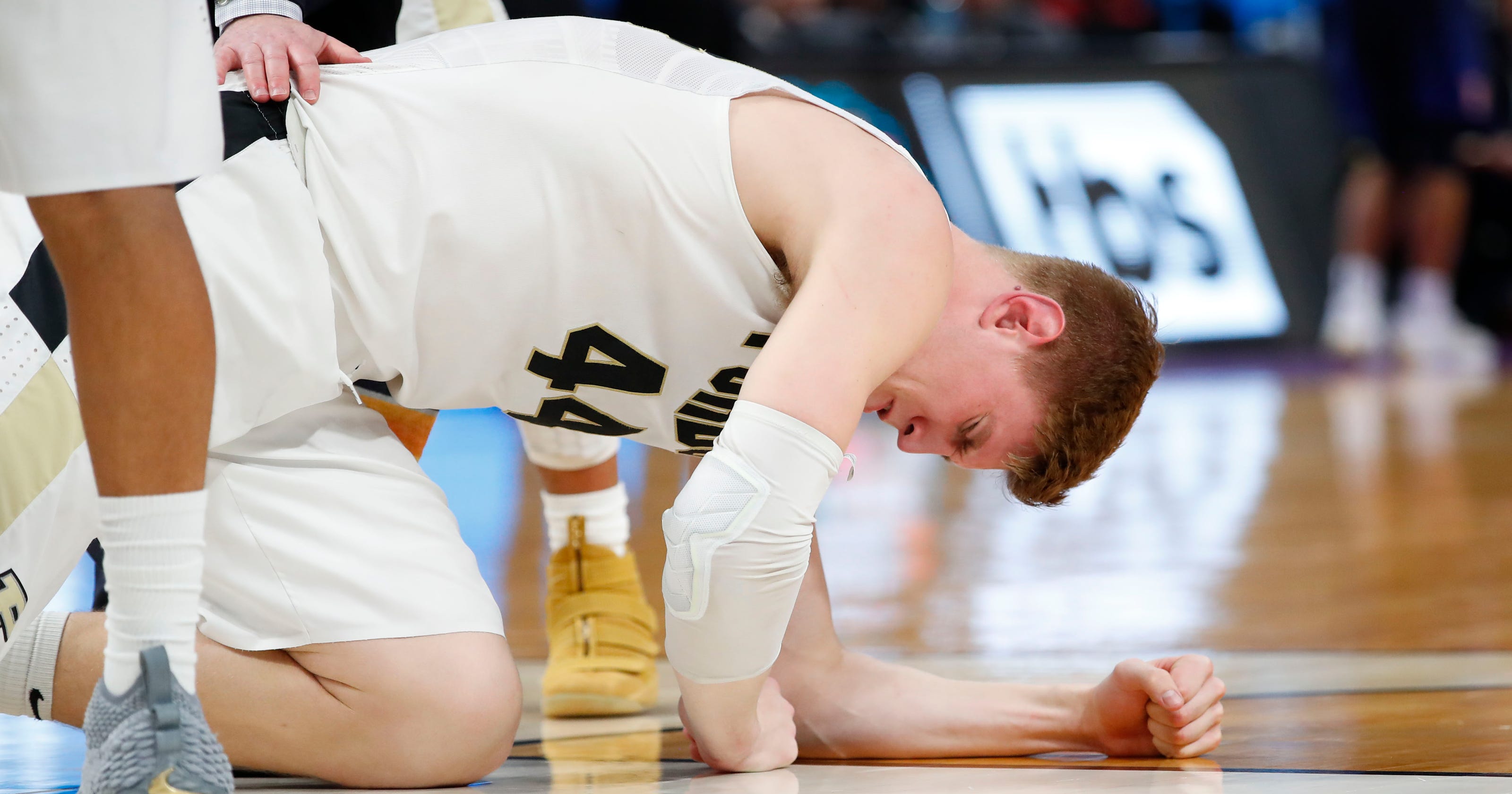 Isaac Haas' broken elbow ends his career at Purdue in NCAA tournament.