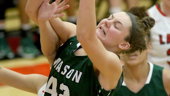 Mason's  Anna Brinkmann grabs a rebound against Lakota West.