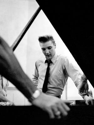 Elvis Presley is pictured at a recording session at RCA Studio on Music Row in Nashville in 1958.
