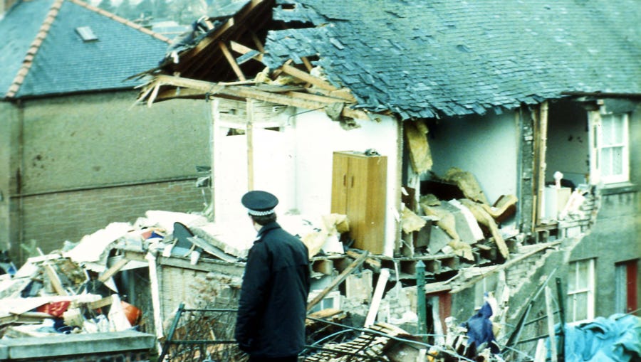 A police officer walks past the damage in Lockerbie, Scotland, caused when Pan Am Flight 103 from London to New York exploded in December 1988.