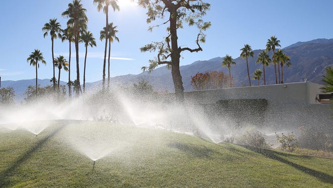 Sprinklers douse a grassy area in Palm Springs.