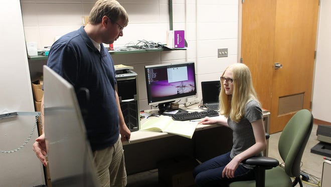 Liza Casella, 17, works with University of Iowa physics graduate student Patrick Wilcox at Van Allen Hall on Wednesday, July 22, 2015. Casella's research is conducted through the UI Belin-Blank Center's Secondary Student Training Program.
