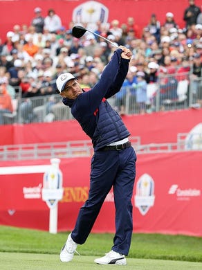 Surfer Kelly Slater of Cocoa Beach hits off the first tee during the 2016 Ryder Cup Celebrity Matches at Hazeltine National Golf Club on Sept. 27, 2016 in Chaska, Minn.