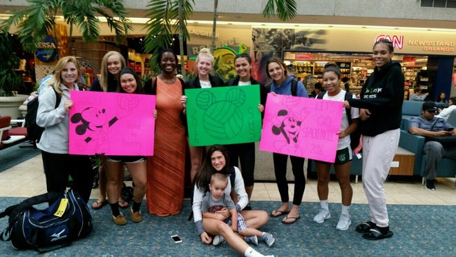 The Spackenkill High School volleyball team poses on its way to a tournament in Disney World.