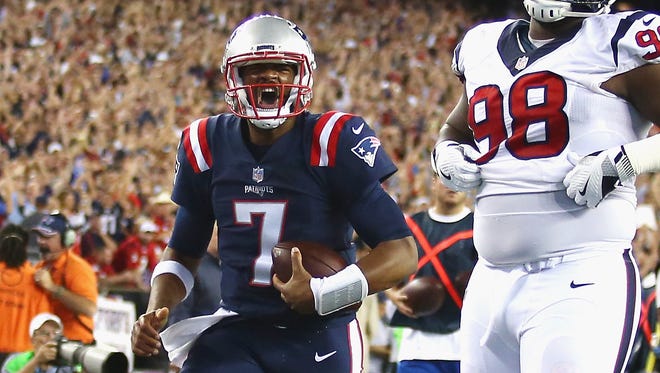 Jacoby Brissett scores a touchdown during the first quarter.