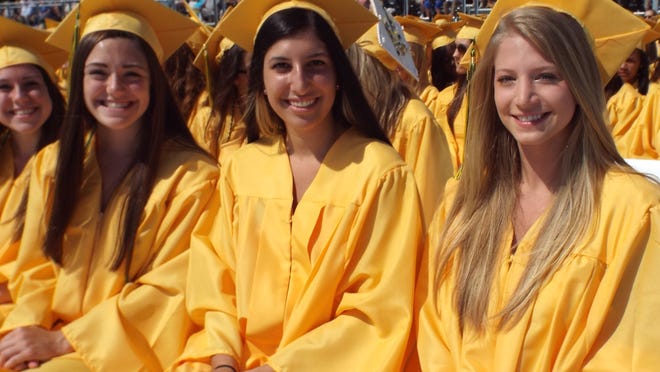 
Franklin D. Roosevelt High School graduates, from left, Jackie Squire, Sabrina Volino and Lauren Joray enjoy commencement Saturday on a beautiful day.
