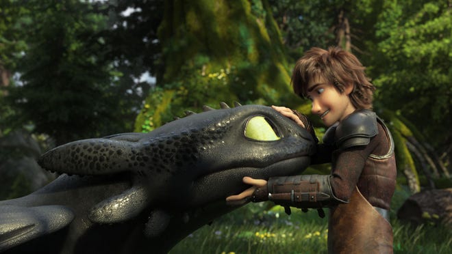 Toothless, left, and Hiccup, voiced by Jay Baruchel, star in “How to Train Your Dragon: The Hidden World.”
