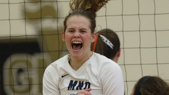 Mount Notre Dame's  Grace Hauck reacts during the Cougars' regional semifinal win over Loveland, Thursday, Nov. 3, 2016.