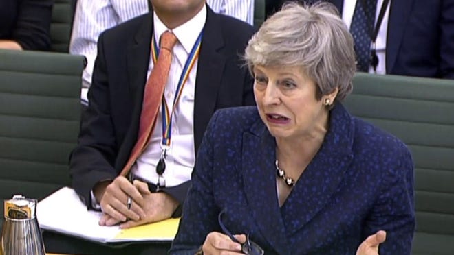 In this grab taken from video, Britain's Prime Minister Theresa May gestures as she gives evidence to the Liaison Select Committee, in the House of Commons, London, Wednesday May 1, 2019.